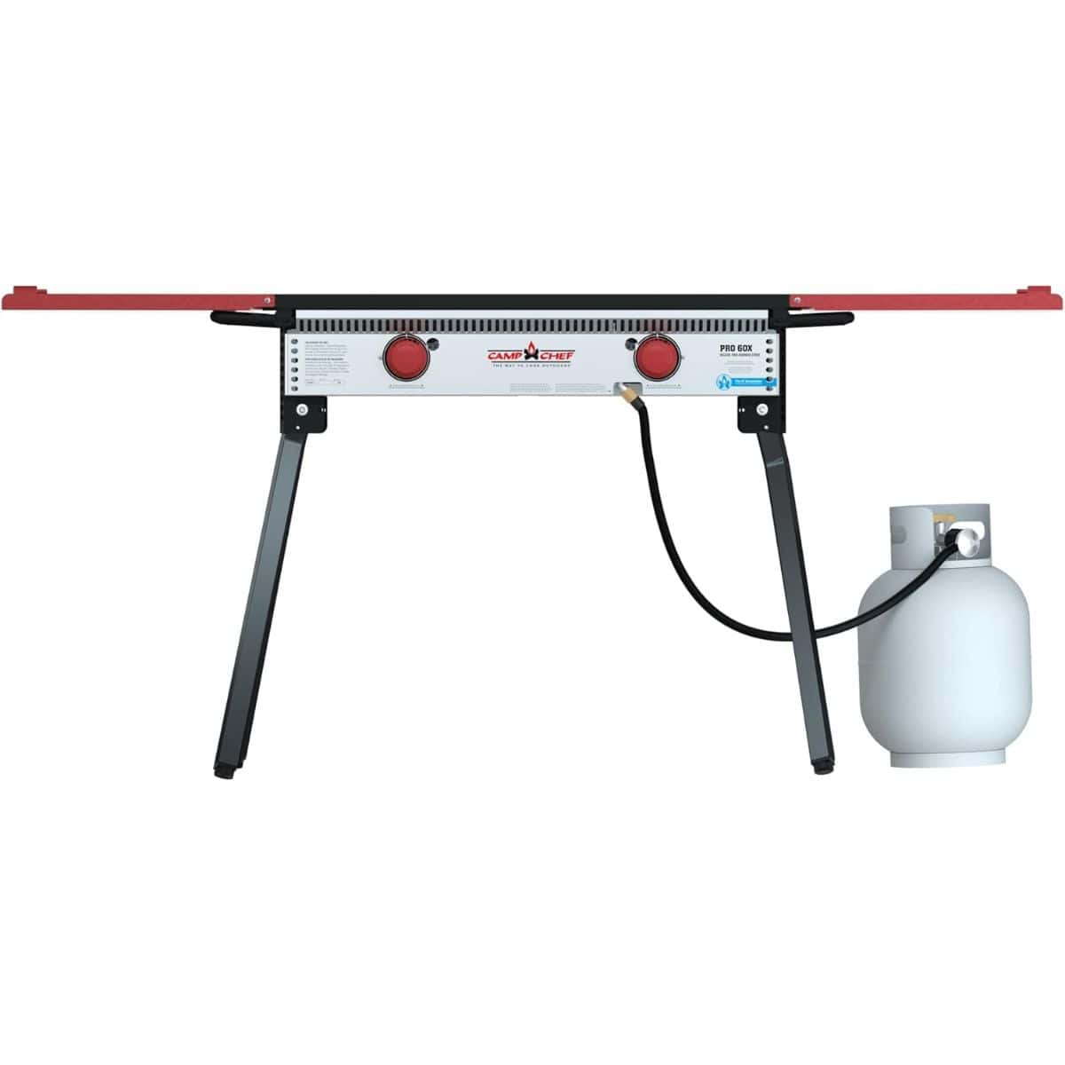 Camp Chef outdoor propane stove with two red control knobs, folding legs, and a connected propane tank, shown on a white background.