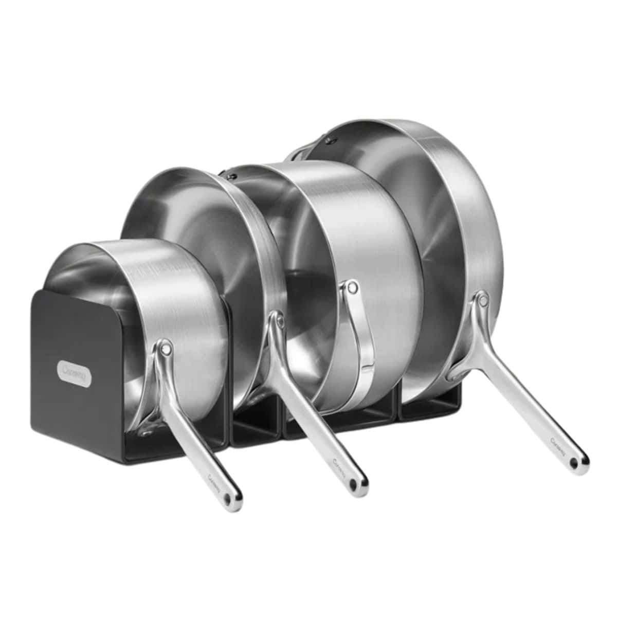 Set of stainless steel saucepans and frying pans neatly organized in a black storage rack.