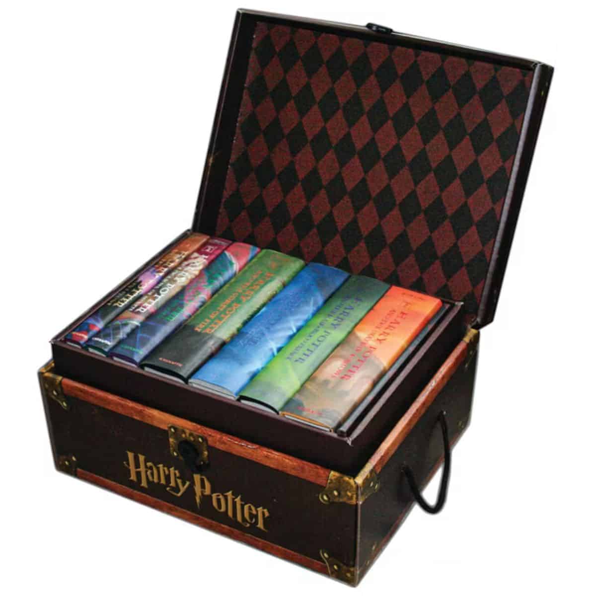 Harry Potter hardcover book collection in a decorative trunk-style box with a checkered lid and gold lettering on the front.