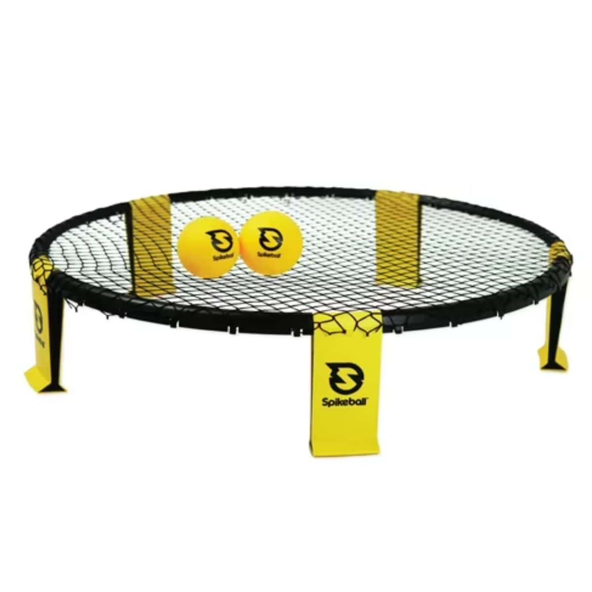 Spikeball game set with round black net frame and two yellow balls featuring the Spikeball logo, displayed on a white background.