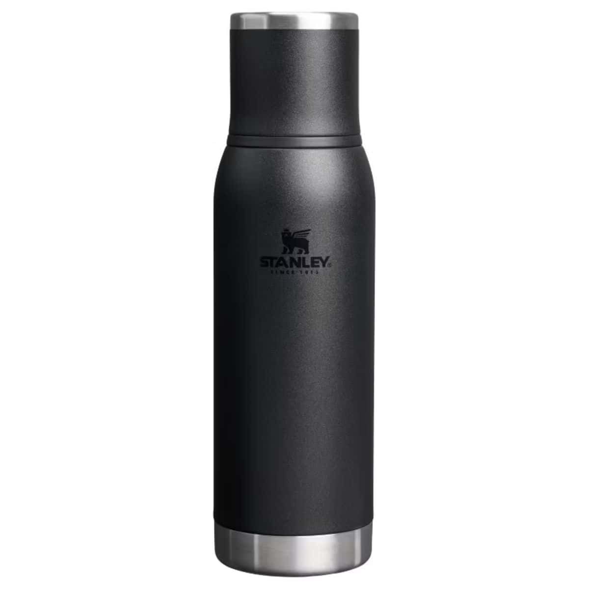 Black Stanley insulated bottle with a matching cup-style lid and stainless steel accents.