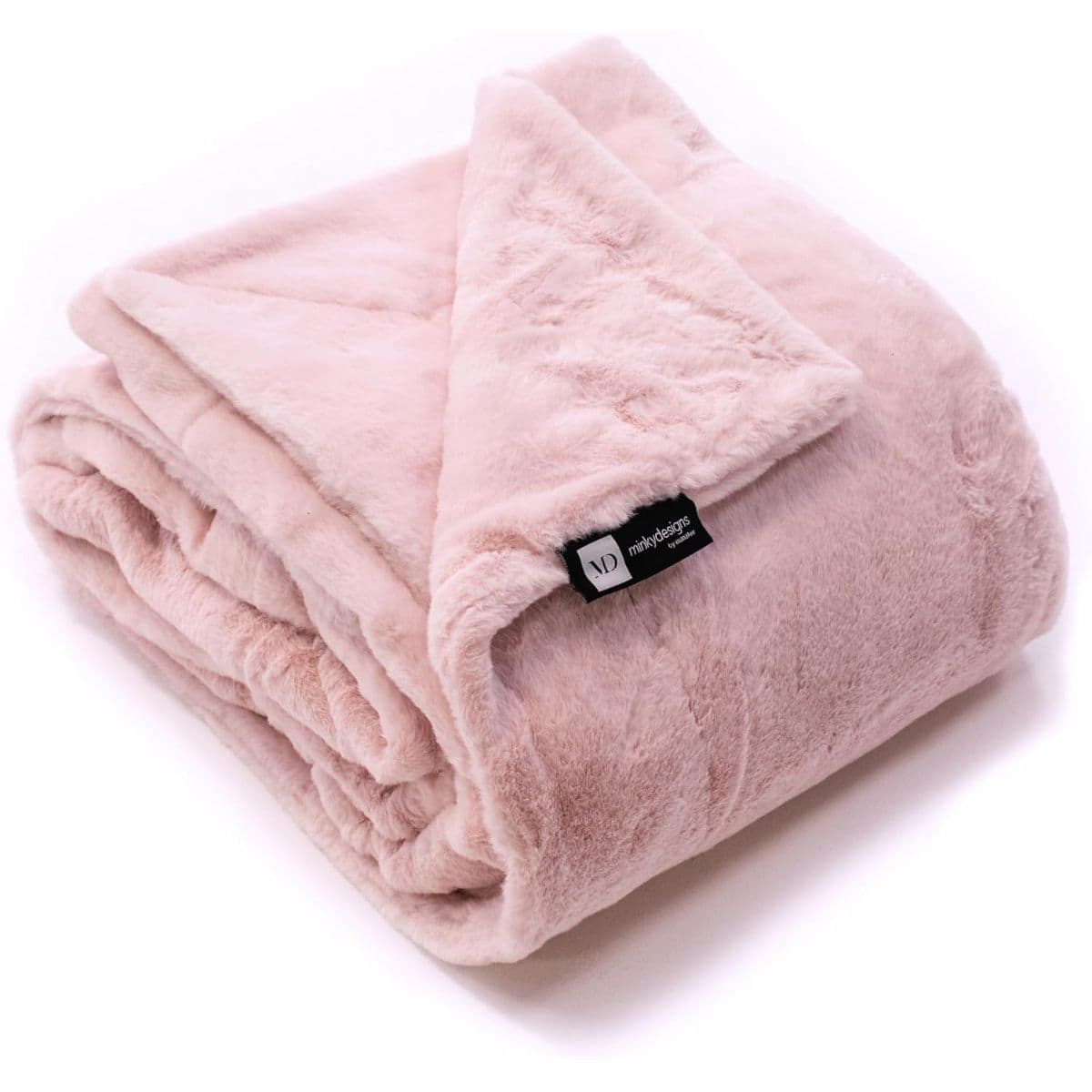 Folded blush pink minky blanket with a soft, plush texture and a black Minky Designs label on the corner.