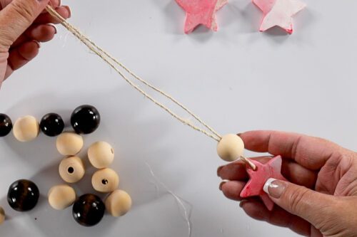 threading a bead onto the ornament
