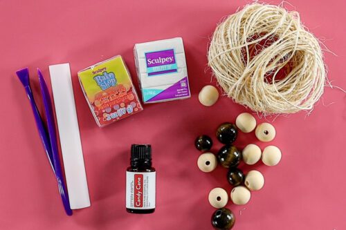 oven-bake clay, twine, wood beads, and essential oil to make our Christmas ornament