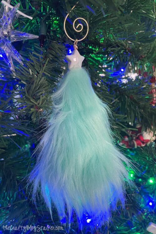faux fur Christmas tree ornament handing on a Christmas tree