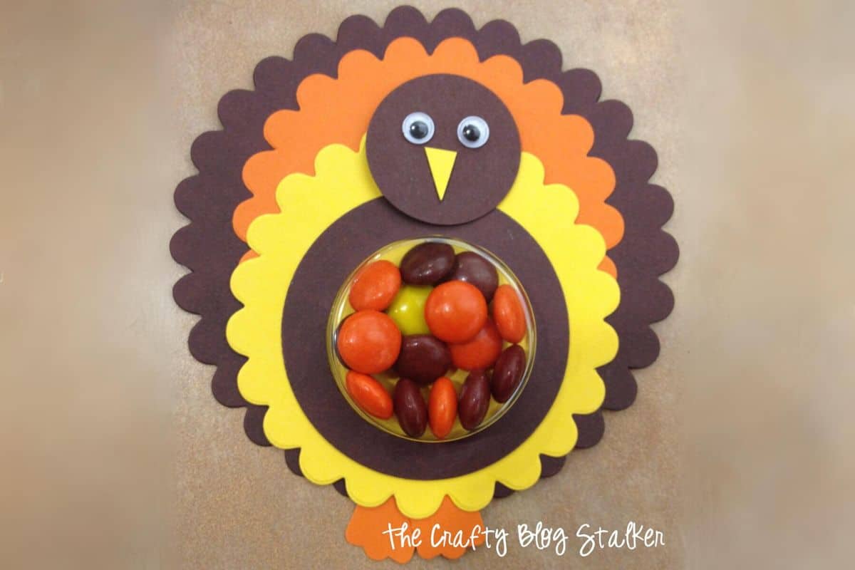 Finished paper turkey with a treat cup in the center.