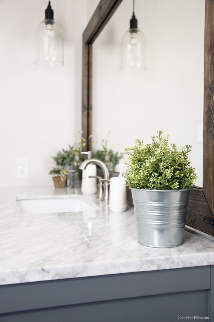 Improve the value of your bathroom with this easy tutorial on How to Frame a Bathroom Mirror! A very easy Home Improvement Project! 