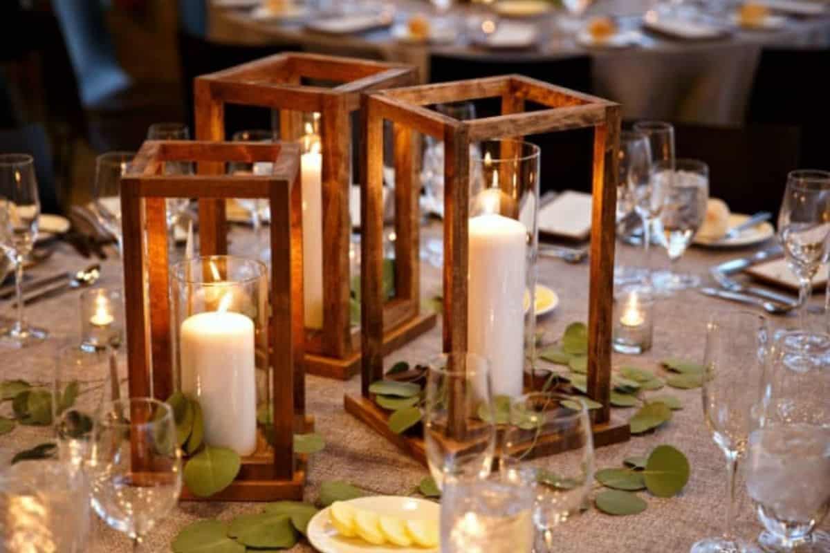 Wood Lantern Centerpieces with a candle in the center.