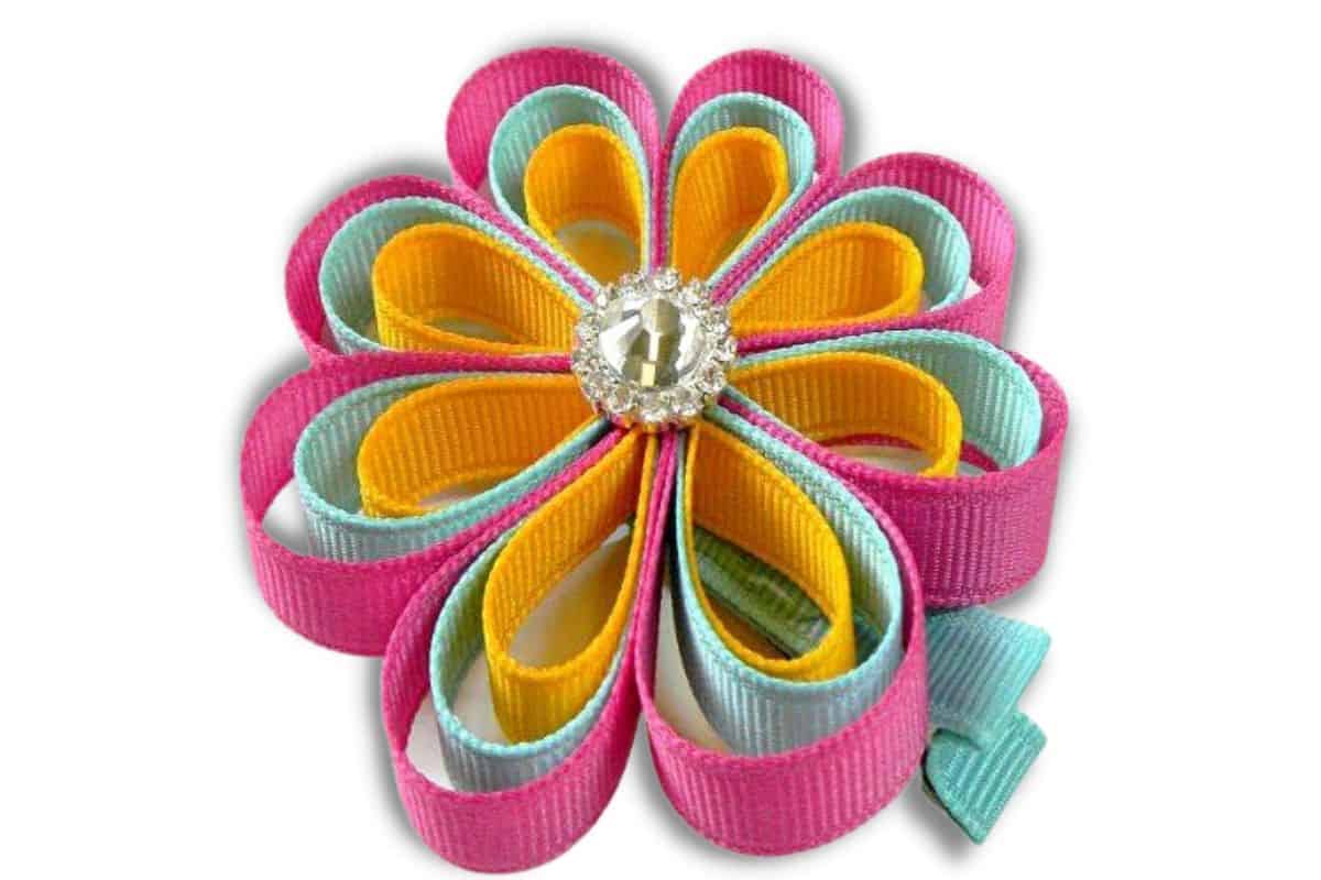Layered loopy flower with a rhinestone center.
