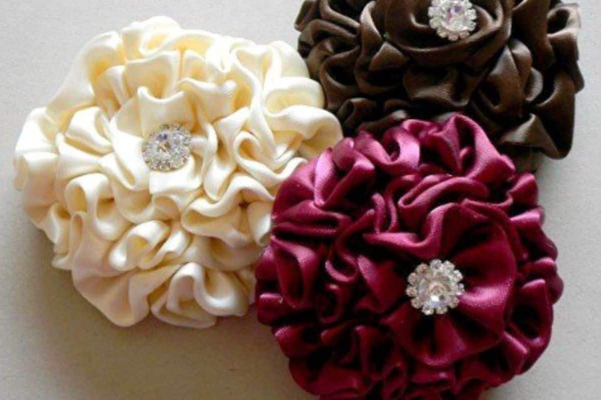 Group of 3 Ruffled Satin Flowers in red, cream and brown.