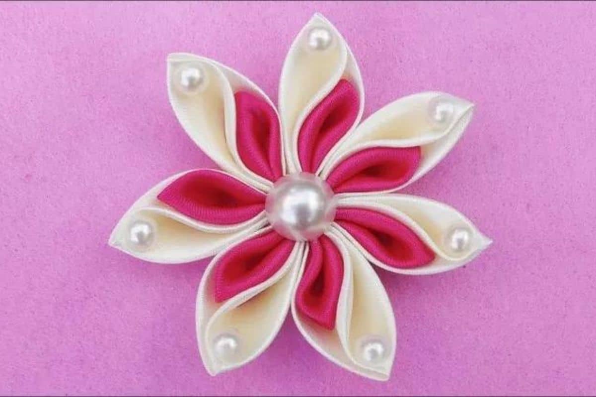 White and pink ribbon flower.
