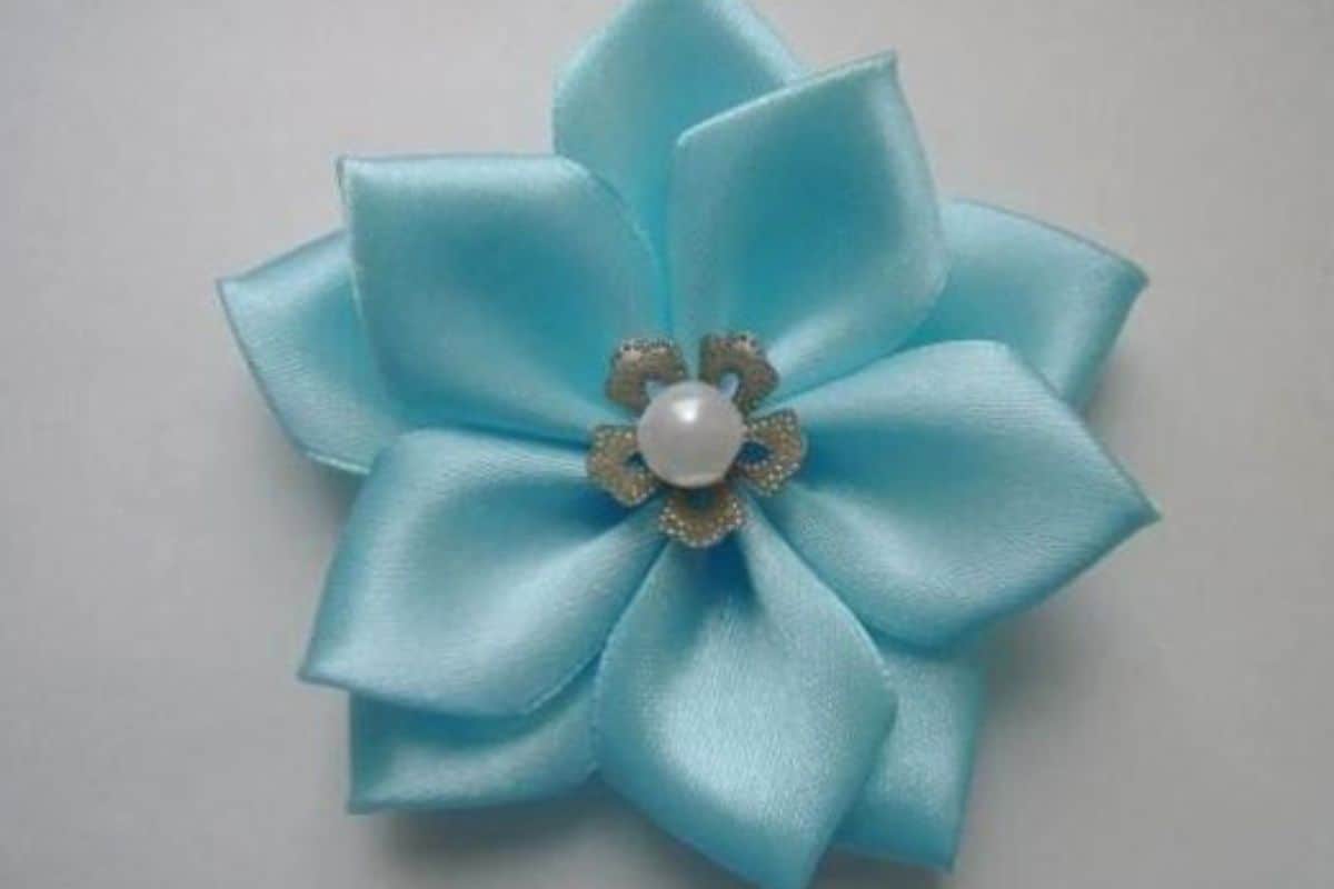 Blue 10 petal ribbon flower.