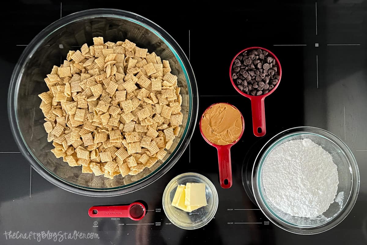 Measured ingredients for rice chex muddy buddies recipe.