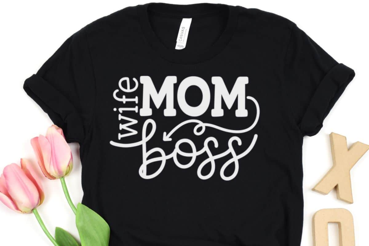 Black shirt with a white design that reads Wife Mom Boss.