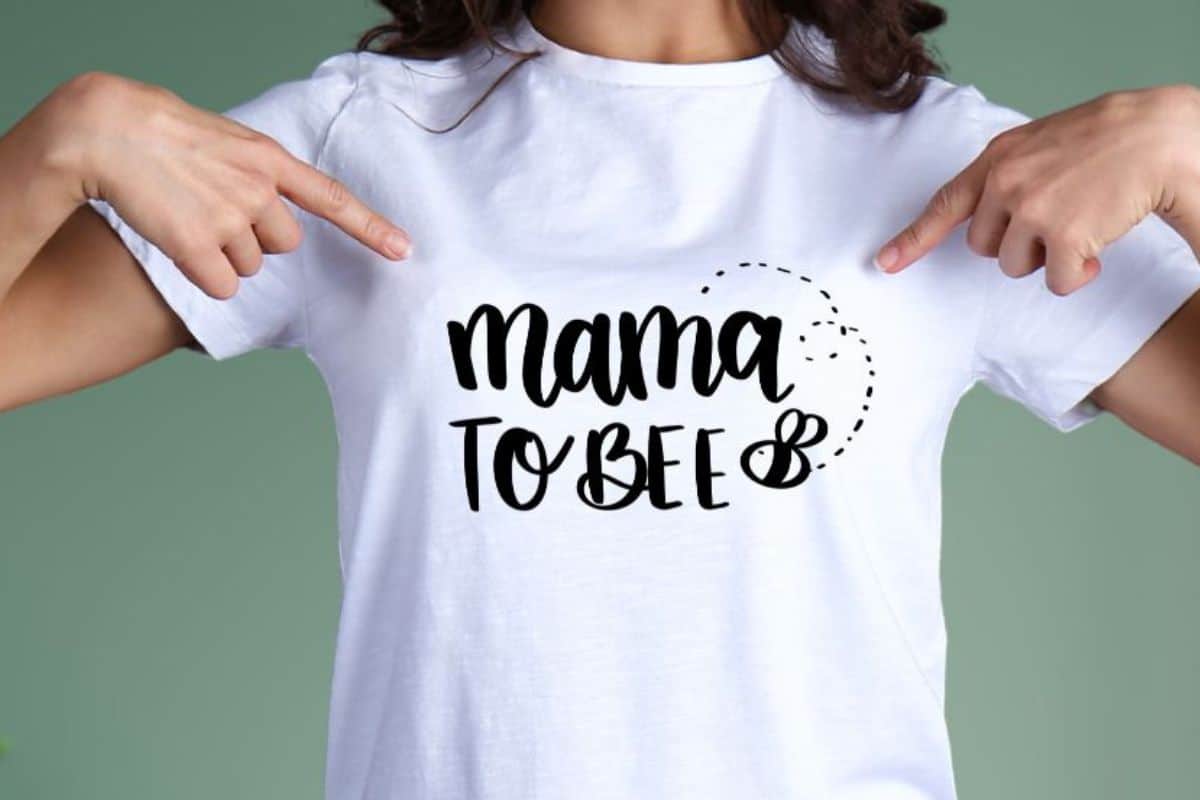 Woman wearing a retro design that says Mama to Bee.