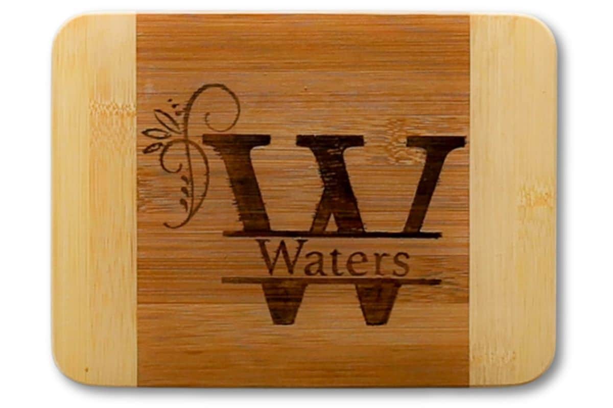 Personalized bamboo cutting board with the W monogram and the last name Waters.