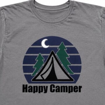 Gray T-shirt with a layered Happy Camper design featuring a tent, pine trees, crescent moon, and blue striped night sky.