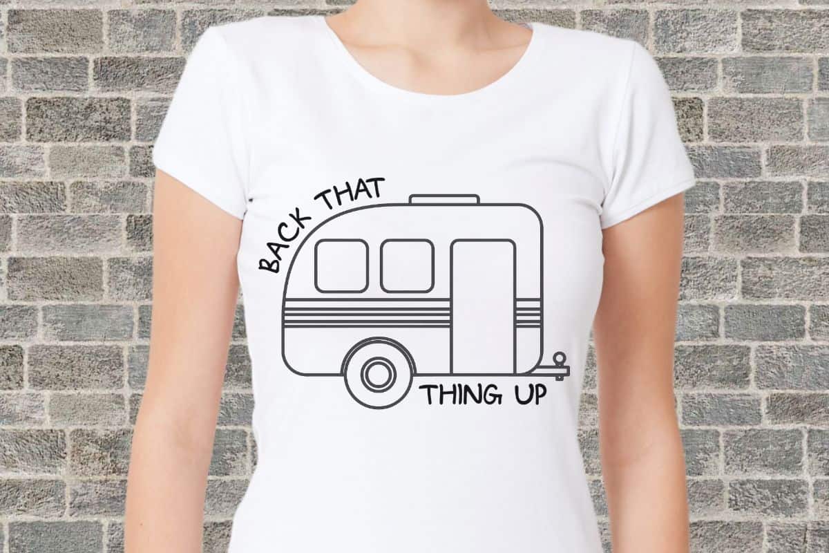 A woman wearing a white shirt with a design that reads 'back that thing up'.