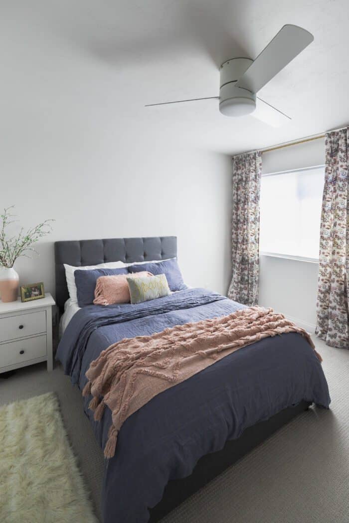 White ceiling fan in tween girls bedroom. 