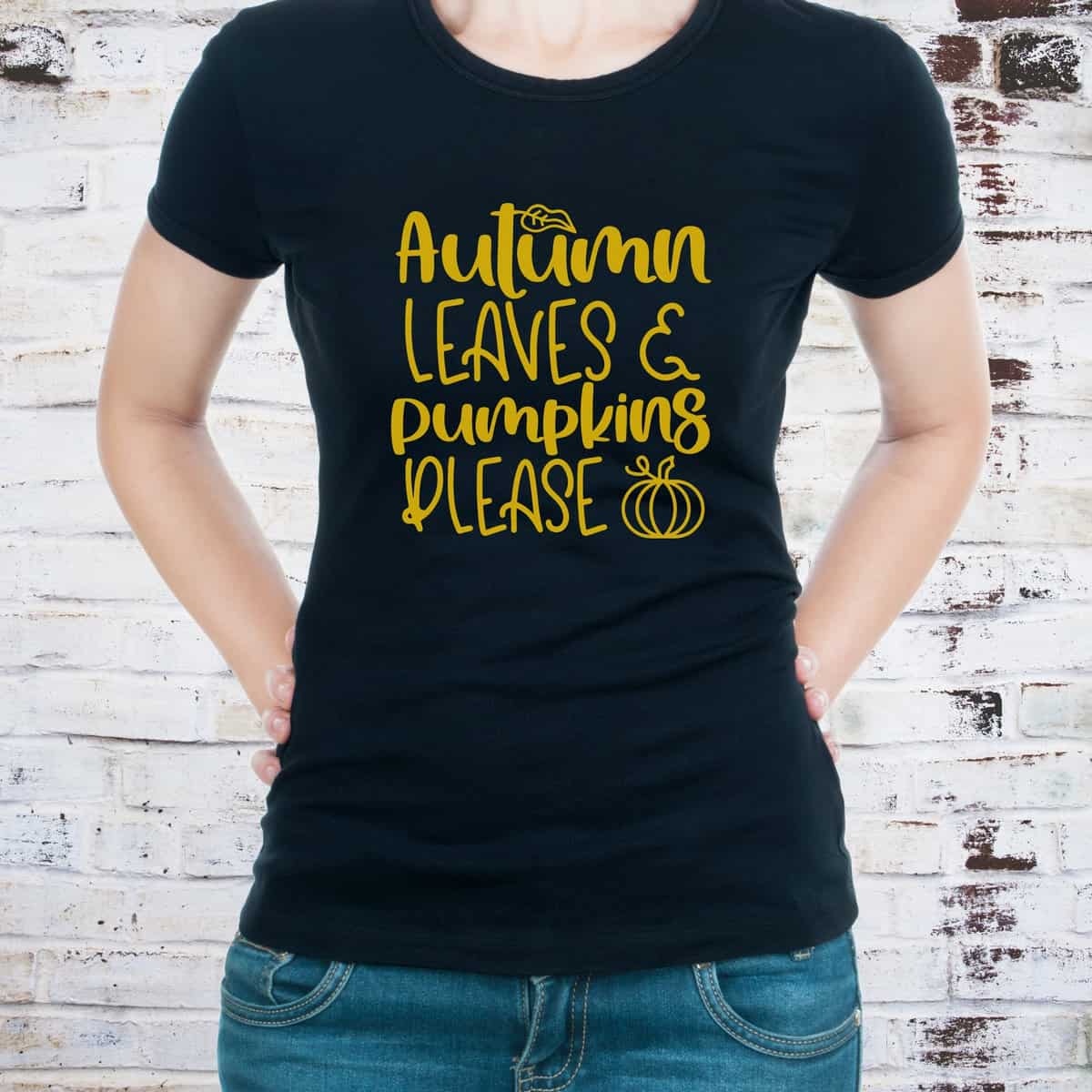 a black shirt with a yellow design that reads, Autumn Leaves and Pumpkin Please 