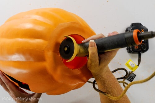 using the angle grinder to create a hole