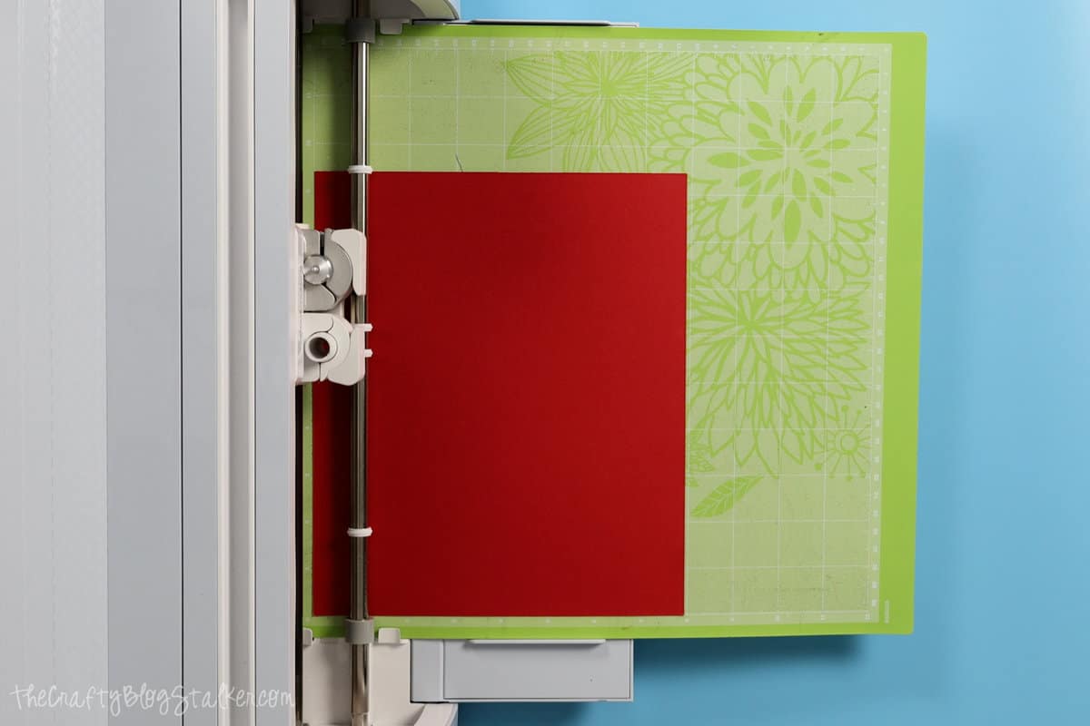 cutting red cardstock on a Cricut