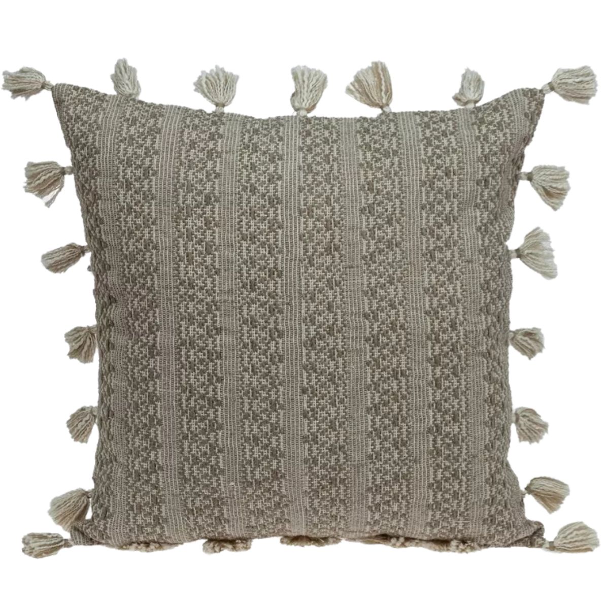 Neutral sand-colored woven throw pillow with subtle striped texture and tassel trim around the edges.