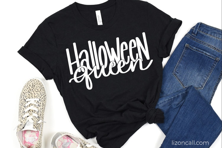 Black t-shirt with a white design that reads 'halloween queen'.