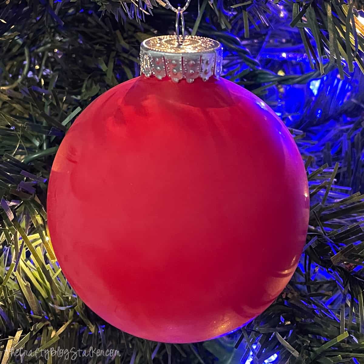 red balloon christmas ornaments on a tree