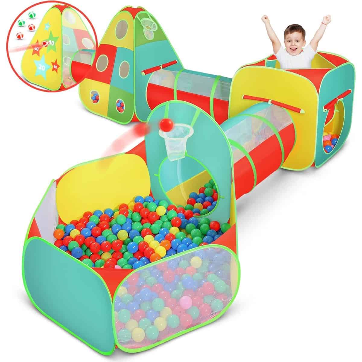 Colorful kids' play tent set with tunnels, a ball pit filled with plastic balls, and a small basketball hoop, shown with a child playing inside.