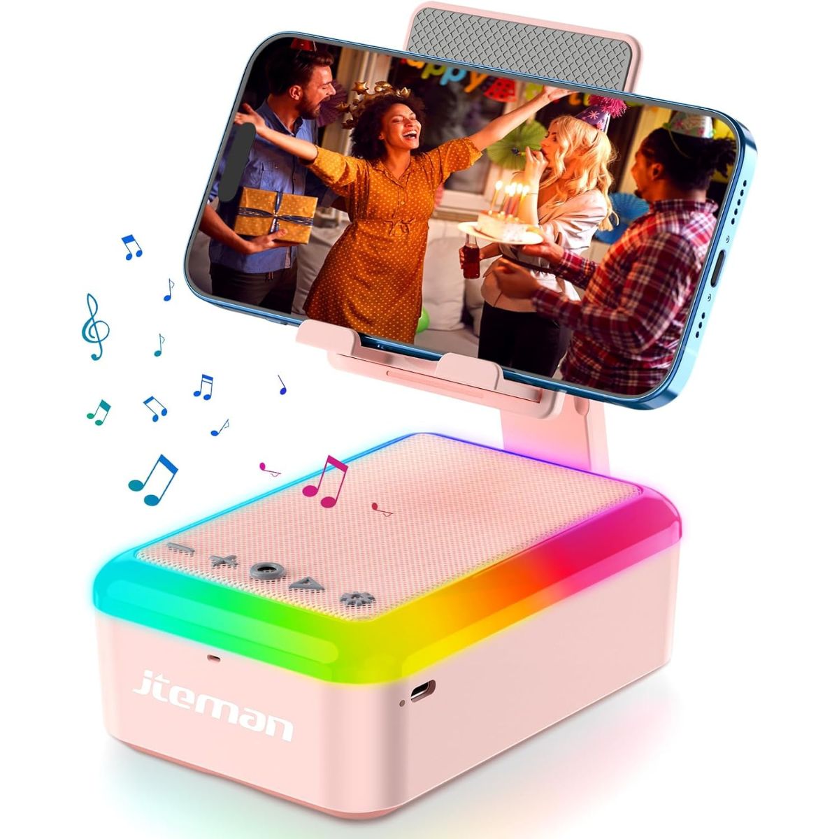Pink cell phone stand with built-in Bluetooth speaker and rainbow LED lights, holding a smartphone playing a party video with music notes floating around.
