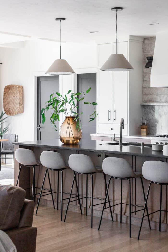 Modern European Kitchen Fall Decor with white oak cabinets and large island. 