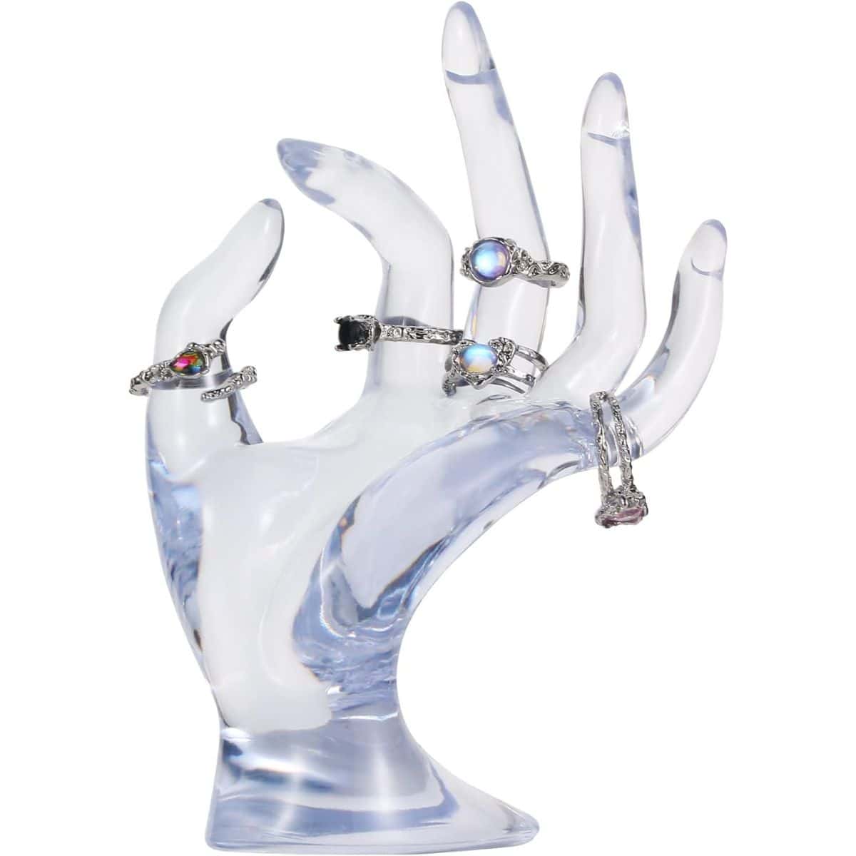 Clear acrylic hand-shaped ring holder displaying several silver rings with colorful gemstones.