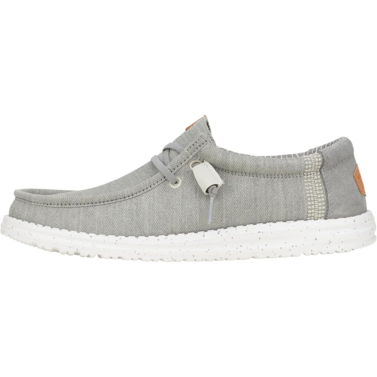 Light gray Hey Dude casual shoe with a white speckled sole, soft fabric upper, and elastic laces.