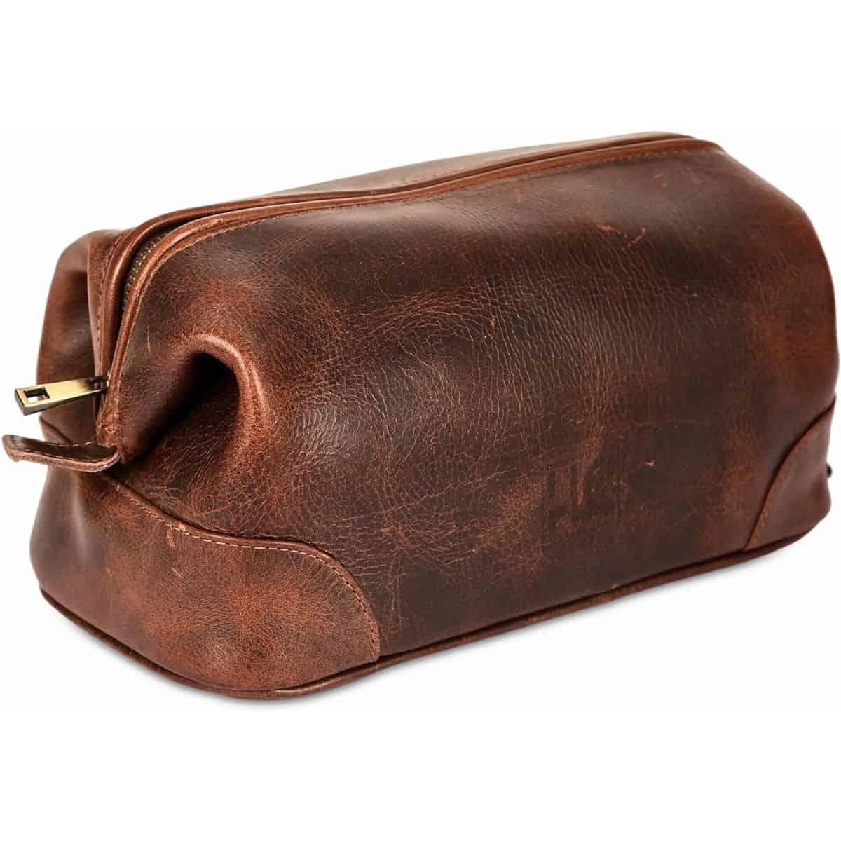 Brown leather toiletry bag with a vintage, distressed finish and a zippered top.