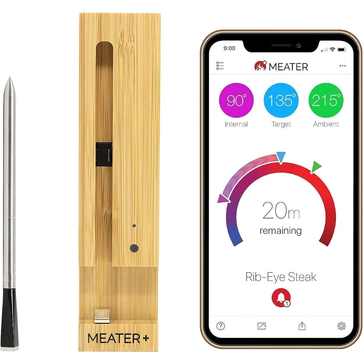 Meater+ wireless meat thermometer with its wooden charging dock shown next to a smartphone displaying the cooking app with internal, target, and ambient temperatures.
