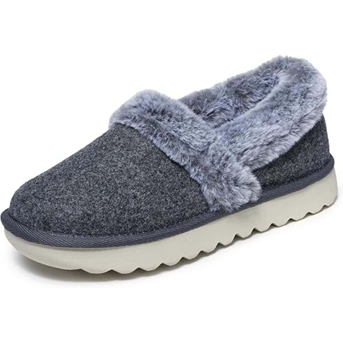 A cozy slip-on slipper with a soft fleece lining, a textured grey upper, and a cushioned sole designed for comfort and indoor wear.