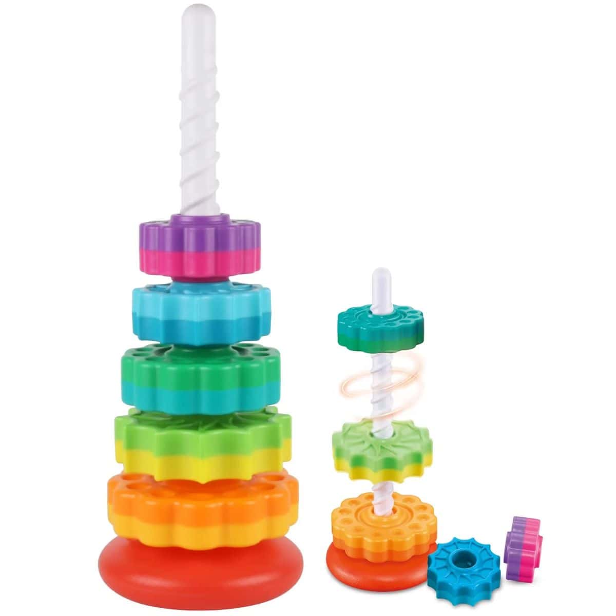 Colorful spinning stacking toy with rainbow-colored gear-shaped discs on white spiral rods, with additional discs beside the base.