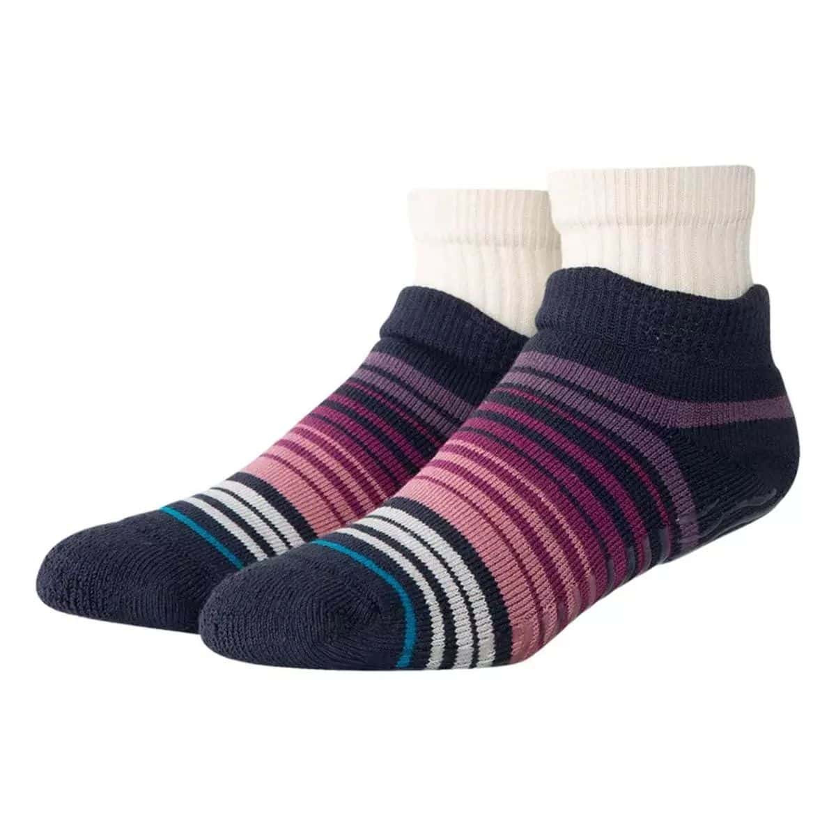 Cozy low-cut slipper socks with navy heels and toes, striped pink and purple knit uppers, and cream ribbed cuffs.