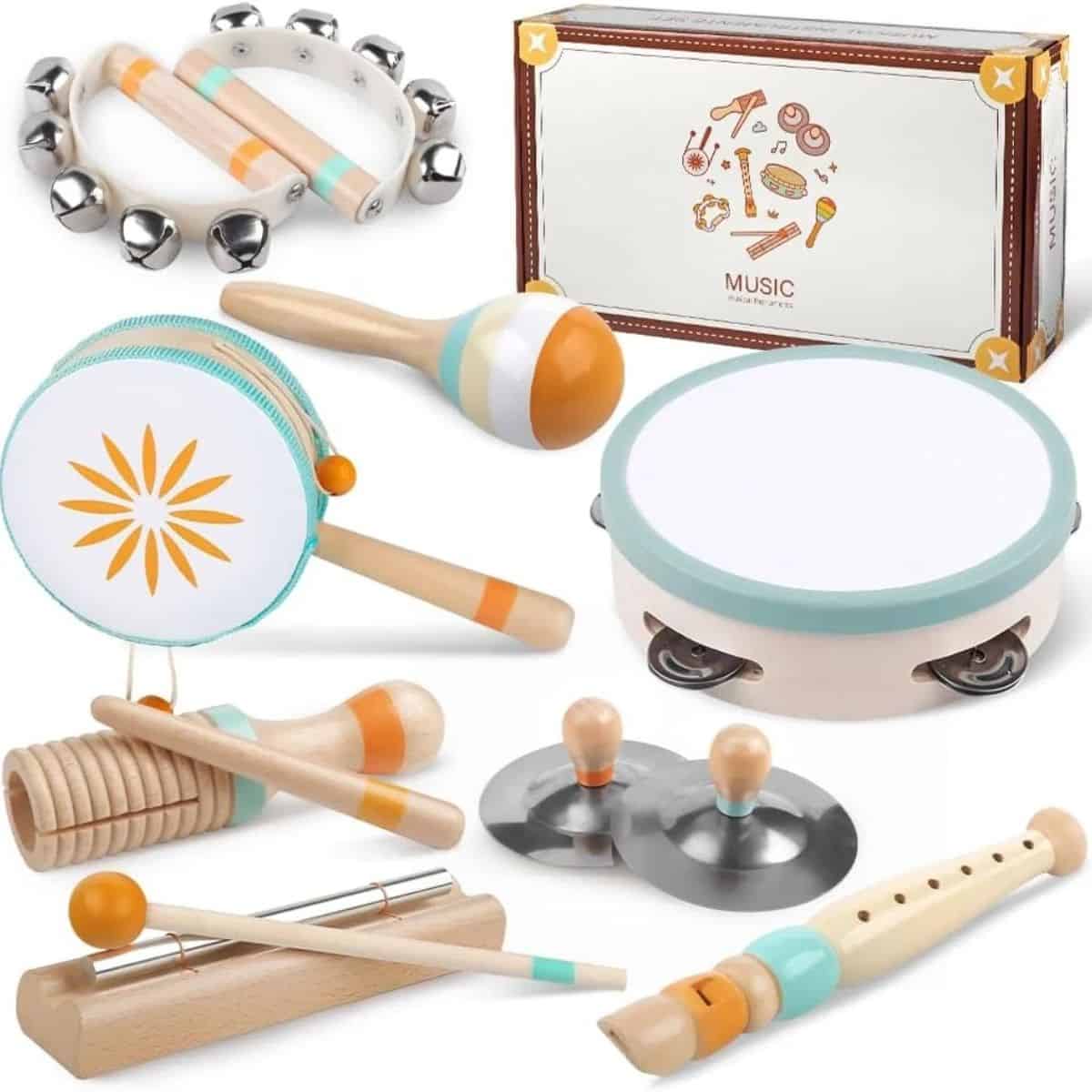 Wooden musical instrument set for toddlers with a drum, tambourine, maracas, cymbals, recorder, and other percussion instruments.