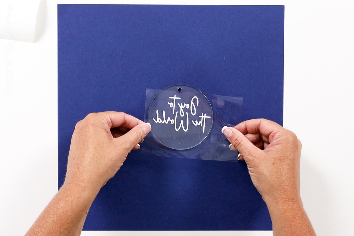 placing the design on an acrylic ornament
