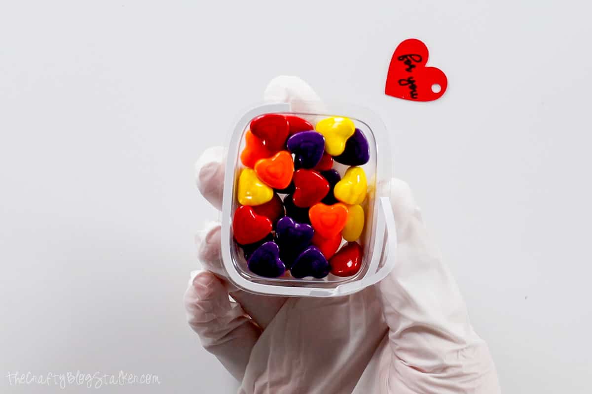 A shaker dome filled with heart candies.