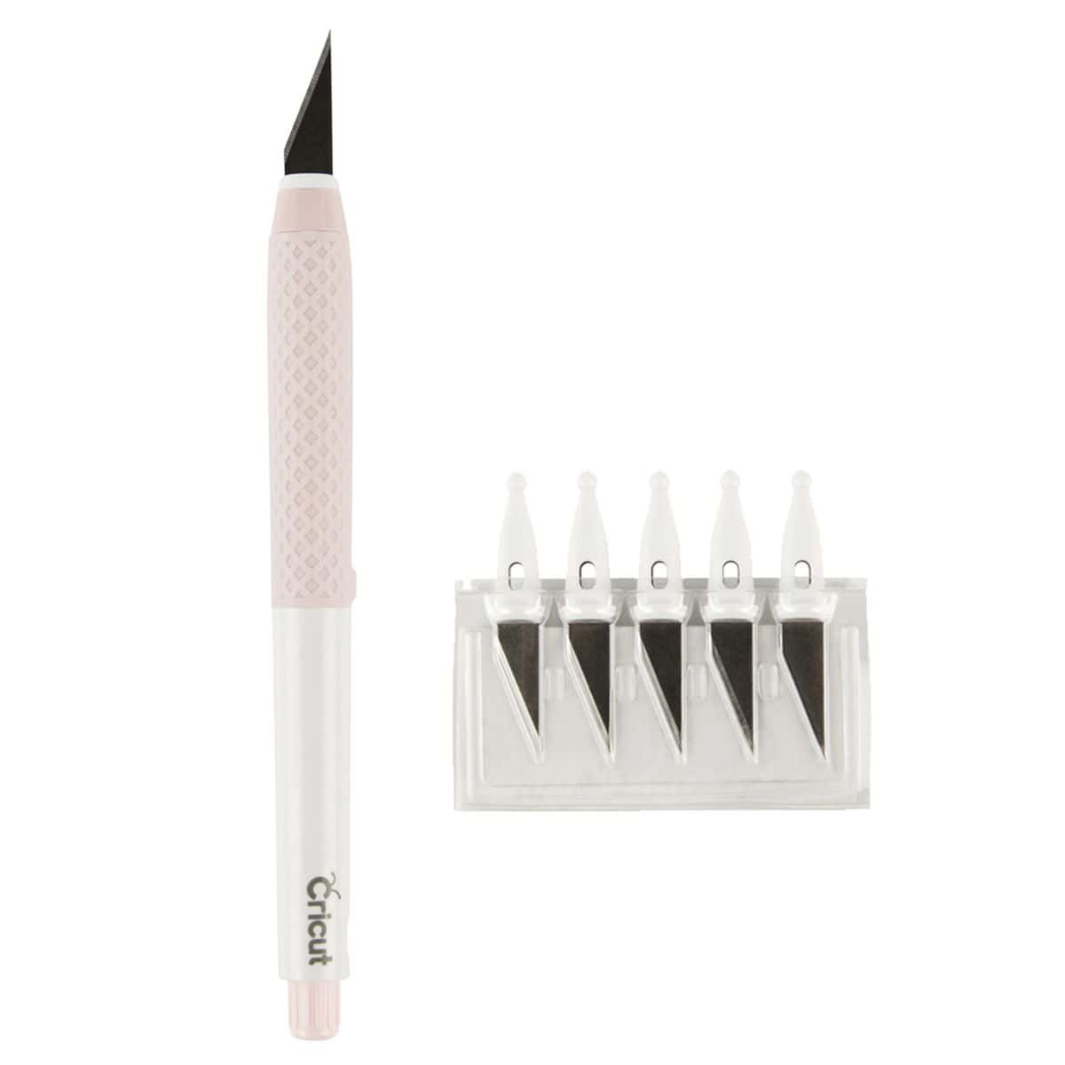 Cricut craft knife with a pink and white handle shown beside a pack of five replacement blades in a clear plastic case.