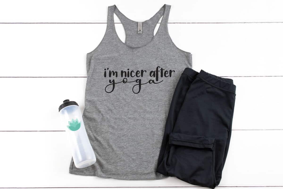 Gray tank top with the design I'm Nicer After Yoga.