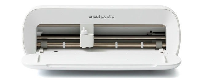 Cricut Joy Xtra cutting machine with its front tray open, showing the blade and roller mechanism, designed for precision crafting and DIY projects.