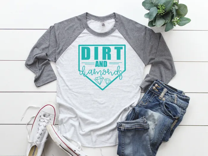 A T-shirt with a design that reads dirt and diamonds.