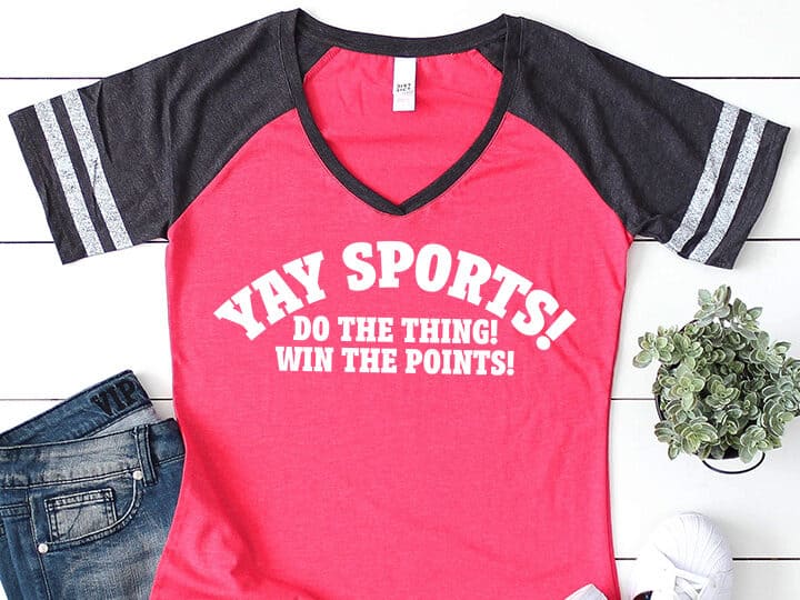 A T-shirt with a design that reads yay sports! Do the thing! Win the points.