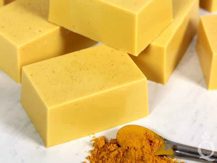 Stacked bars of turmeric soap.