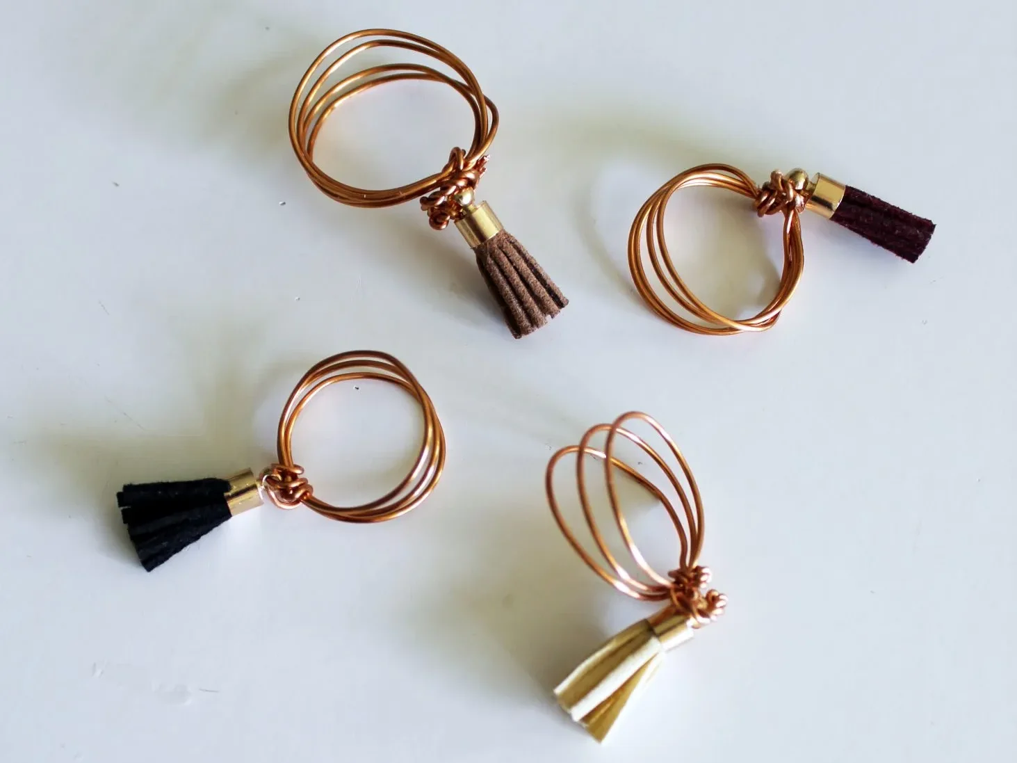 Wire Ring with Leather Tassels.