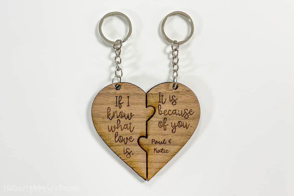 A pair of heart puzzle key chains side by side.